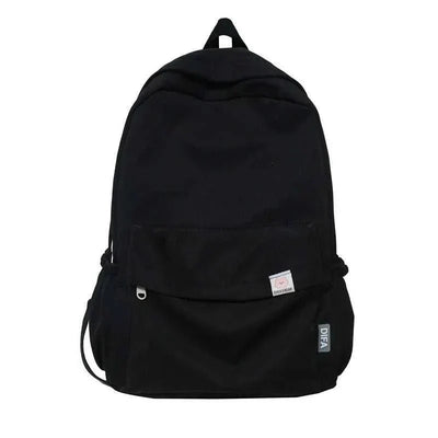 Waterproof backpack in solid color with multiple compartments and laptop sleeve, ideal for travel and school.