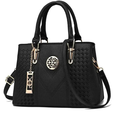 Fashion women's large-capacity shoulder bag in black PU leather with adjustable strap and multiple compartments.