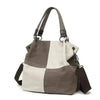 Canvas retro bag with dual handles and adjustable shoulder strap, stylish and spacious for women's daily use.