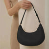 Designer Y2K Half Moon Shoulder Bag for Women in black leather with adjustable strap, trendy and spacious.