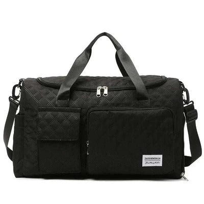 Large black canvas fashion travel bag with multiple compartments and adjustable strap.