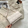 Fashion Brand Designer Shoulder Bag with quilted design on a beige background.